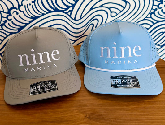1010/26 - YOUTH HAT WHITE NINE MARINA LOGO EMBROIDERED